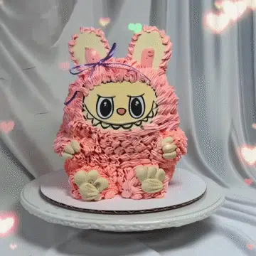 Labubu birthday cake with pink frosting and heart decorations