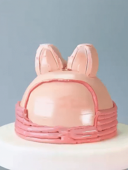 Labubu cake with piped pink buttercream outline and ears