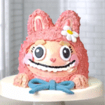 Labubu cake for girls with pink fur and blue bow