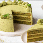 Three-layer matcha cake with creamy green tea frosting and mint on top