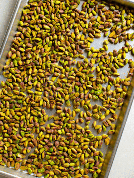 Toasted pistachios on baking sheet