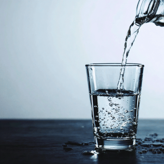 Water being poured into a clear glass